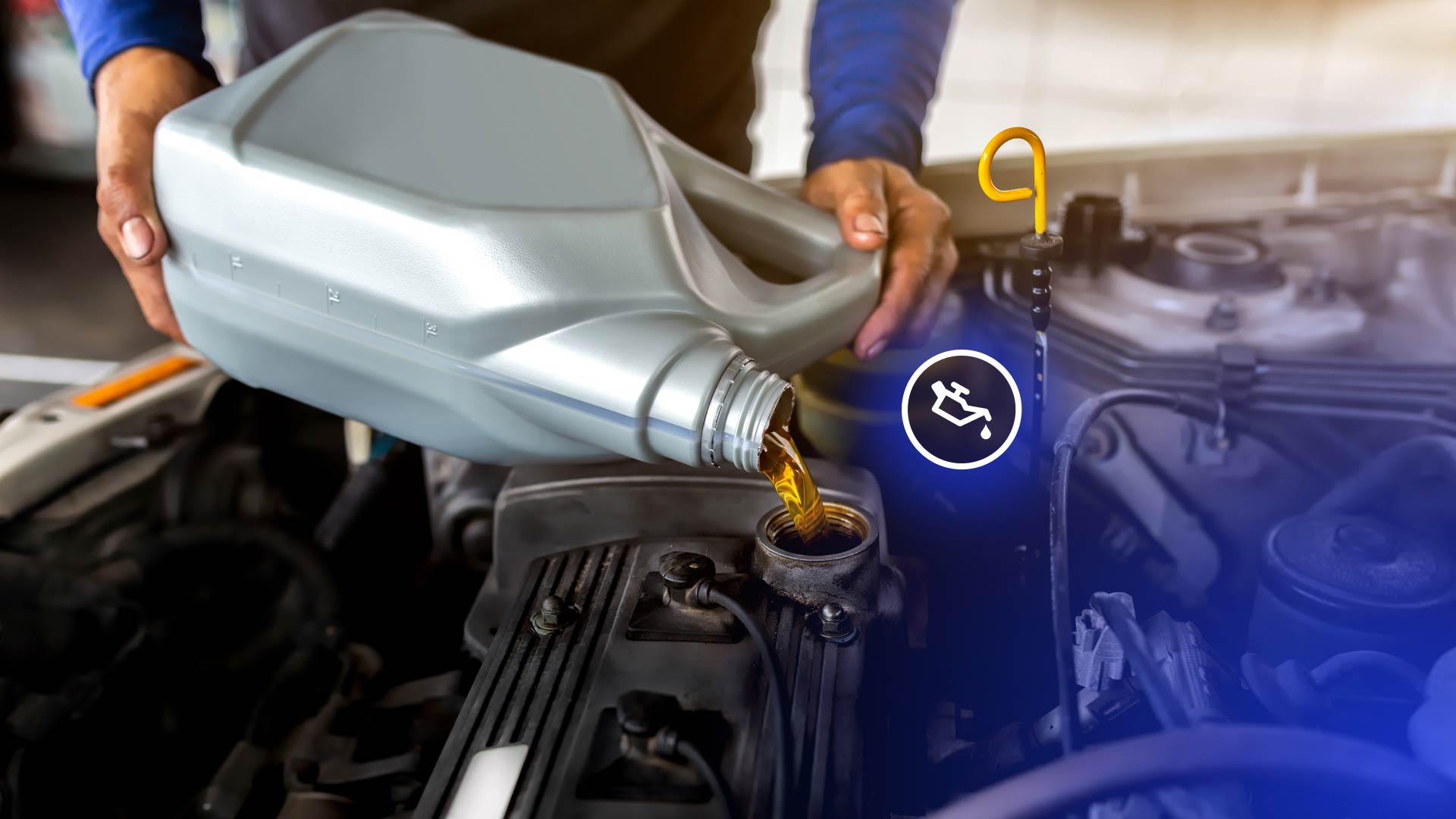 Motor oil being added to a vehicle's engine at a quick lube shop.