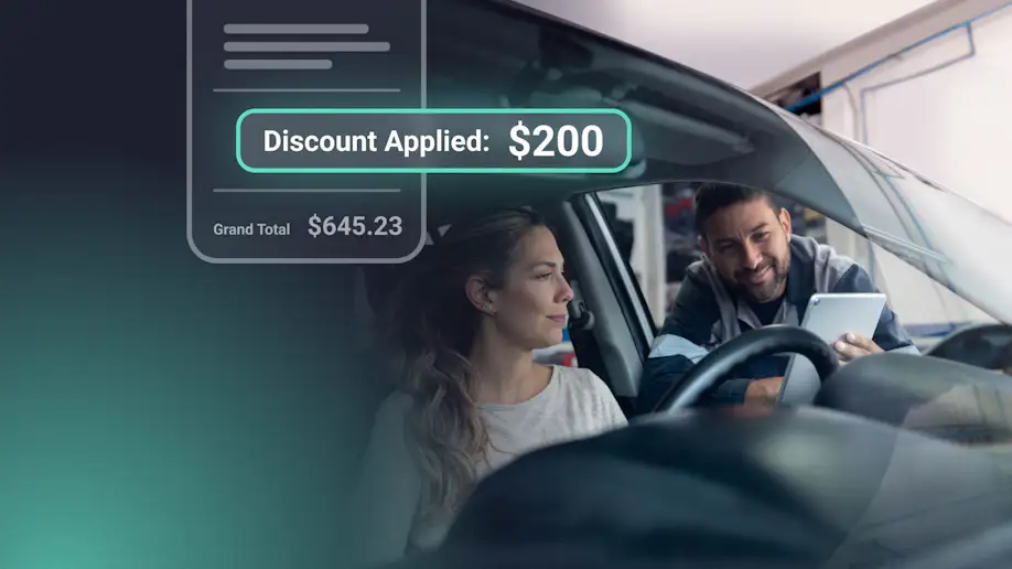 An auto repair shop owner applying a discount to a customer invoice.