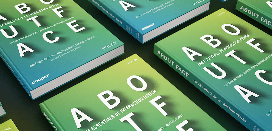 several books laying next to each other on a table, each book has a gradient lime green to turquoise cover with white block text reading ABOUTFACE