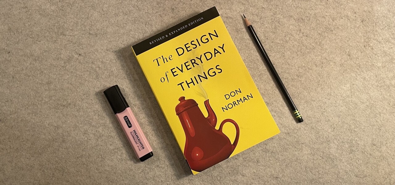 book with yellow cover featuring a red kettle and black text reading the design of everyday things