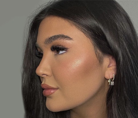 Woman showing left side of her face