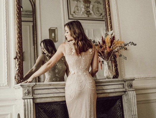 Woman posing in front of a mirror