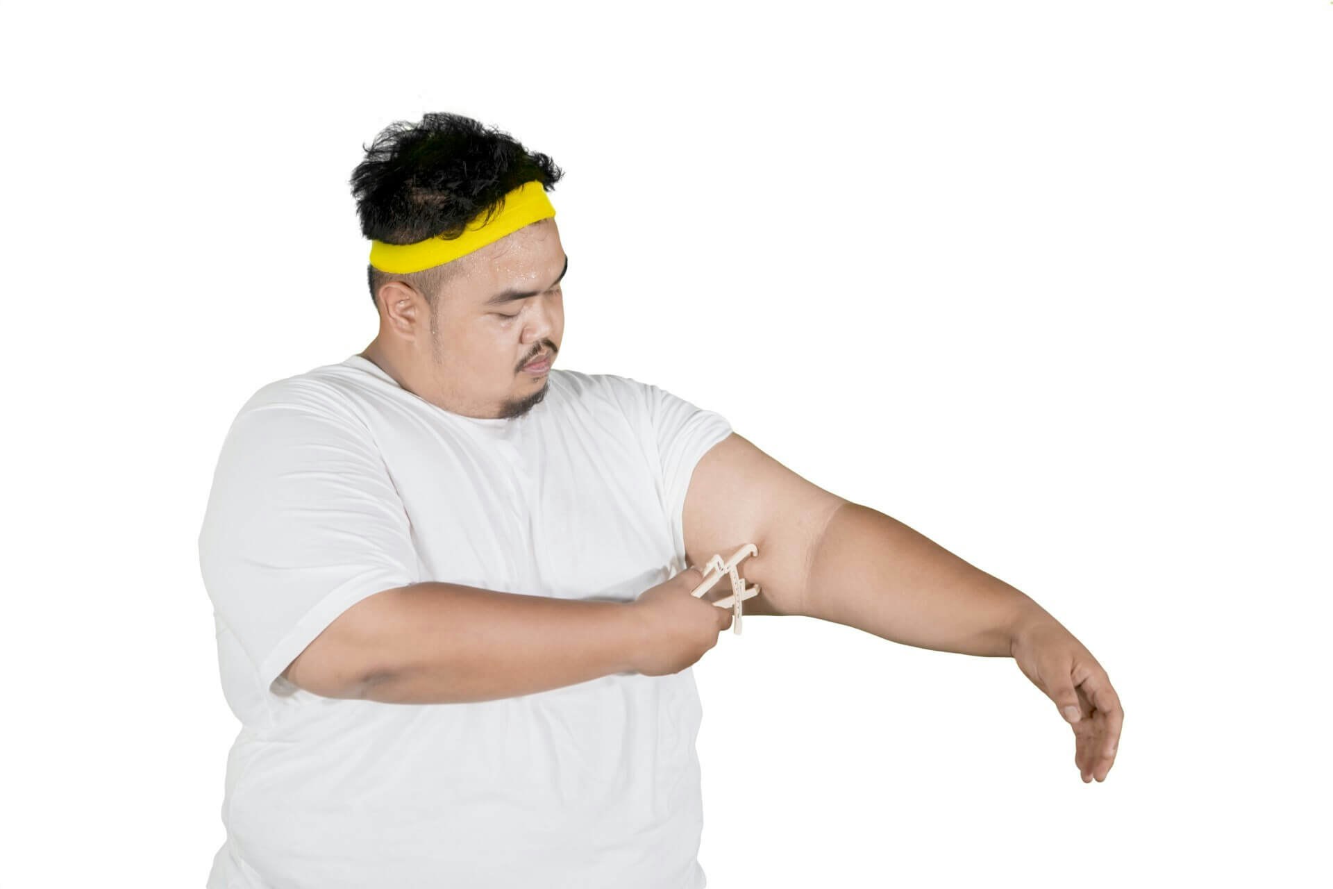 Fat guy pinching his arm