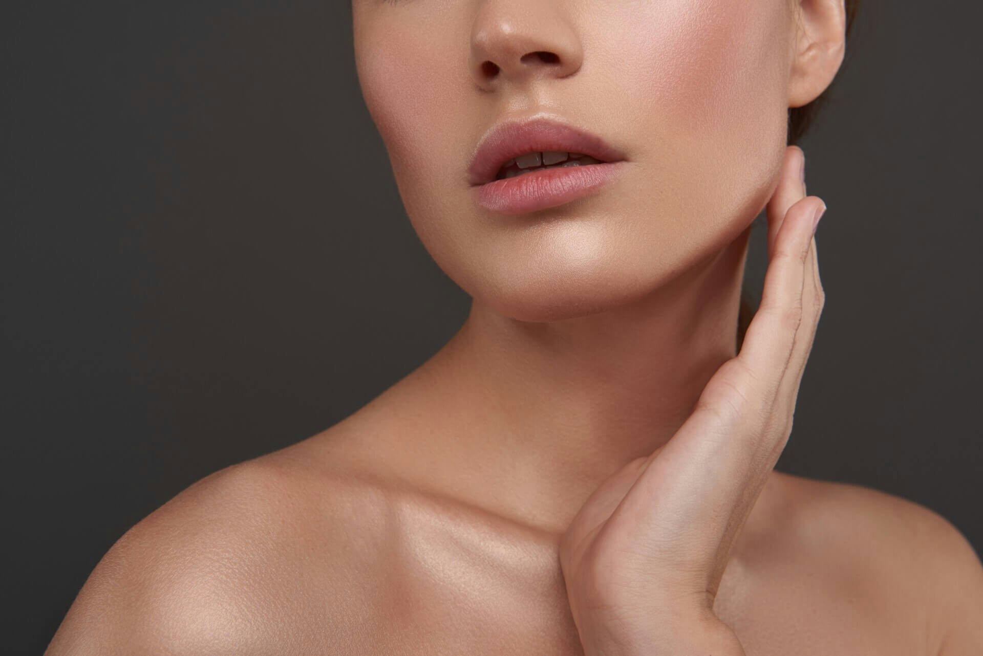Woman touching her jaw