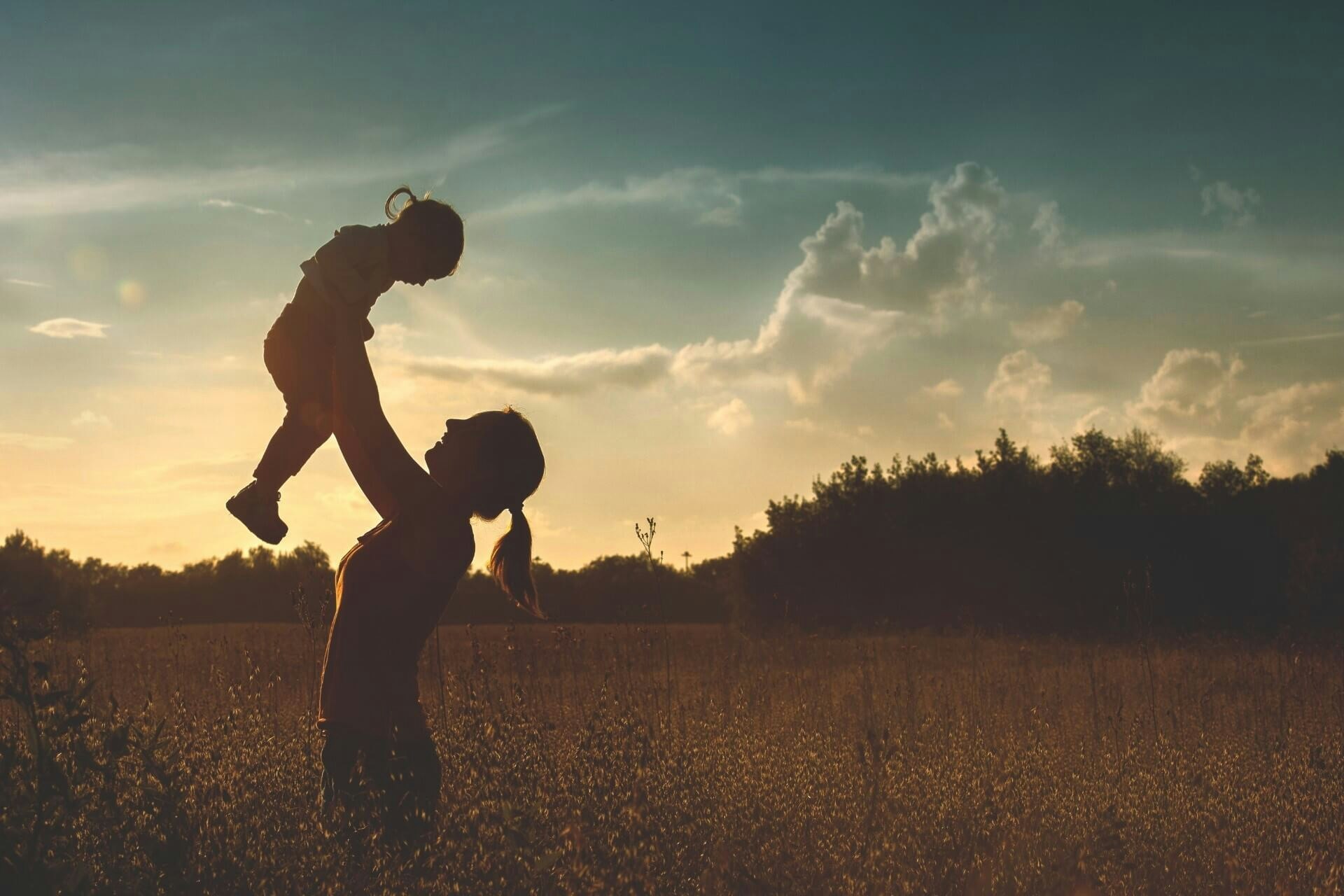 woman carrying a girl
