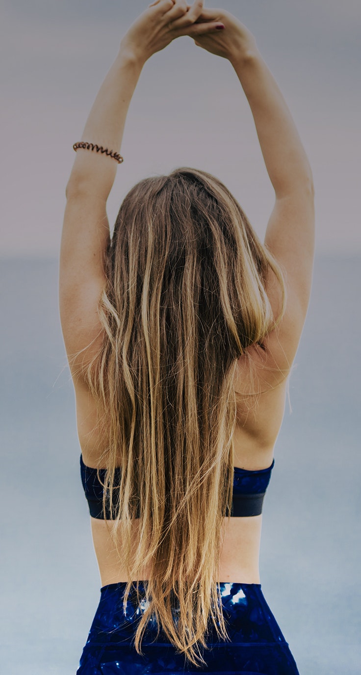 Woman with arms stretched overhead
