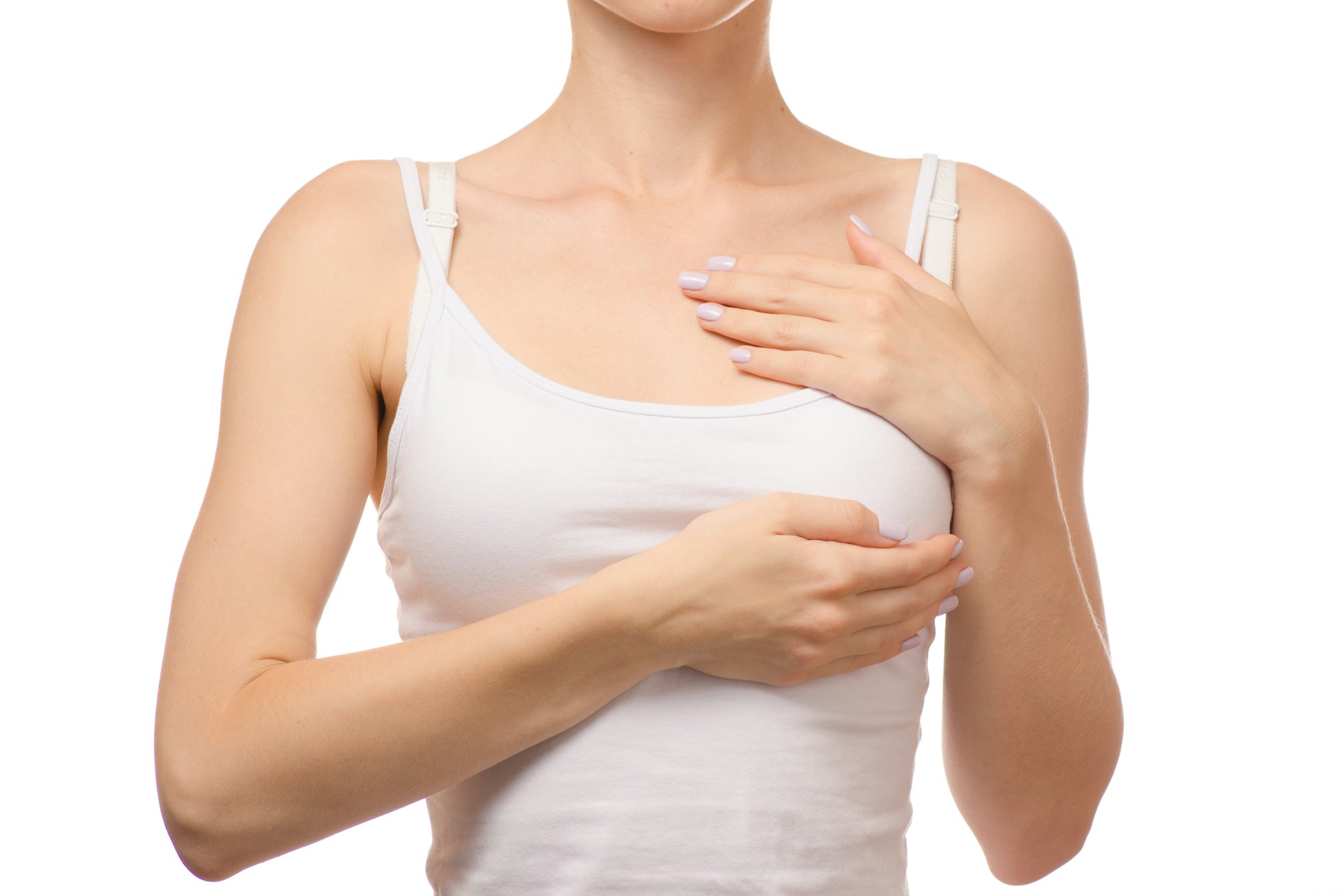 woman holding one breast in white tank top