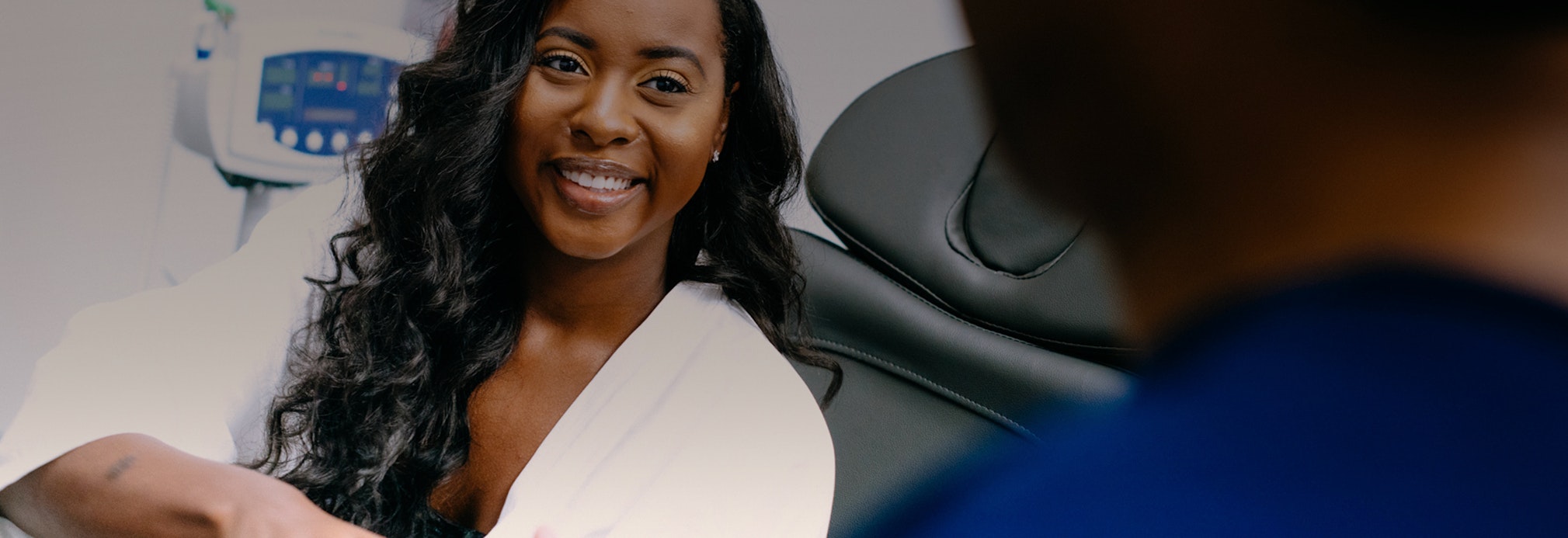Woman smiling at doctor