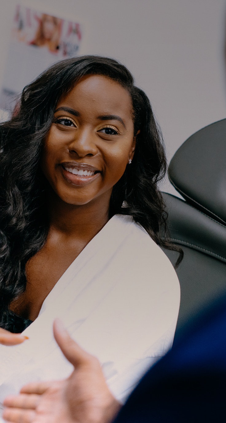 Woman smiling at doctor