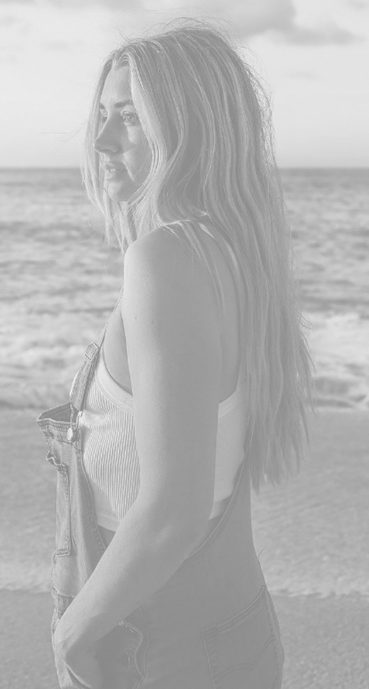 Woman staring out at ocean