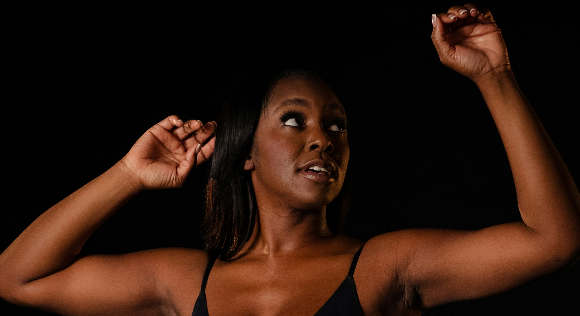Woman with hands overhead