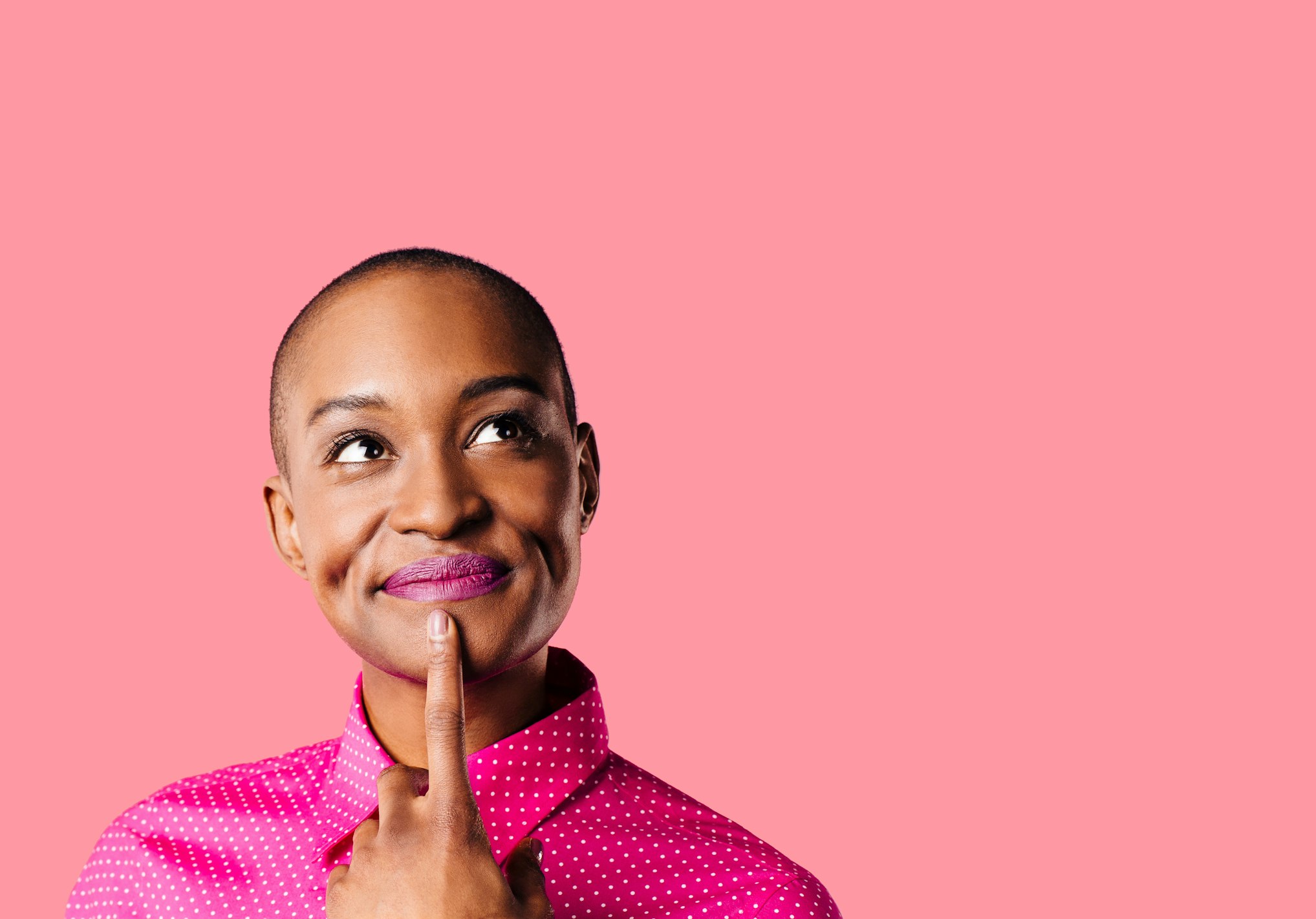 woman thinking with hand on chin