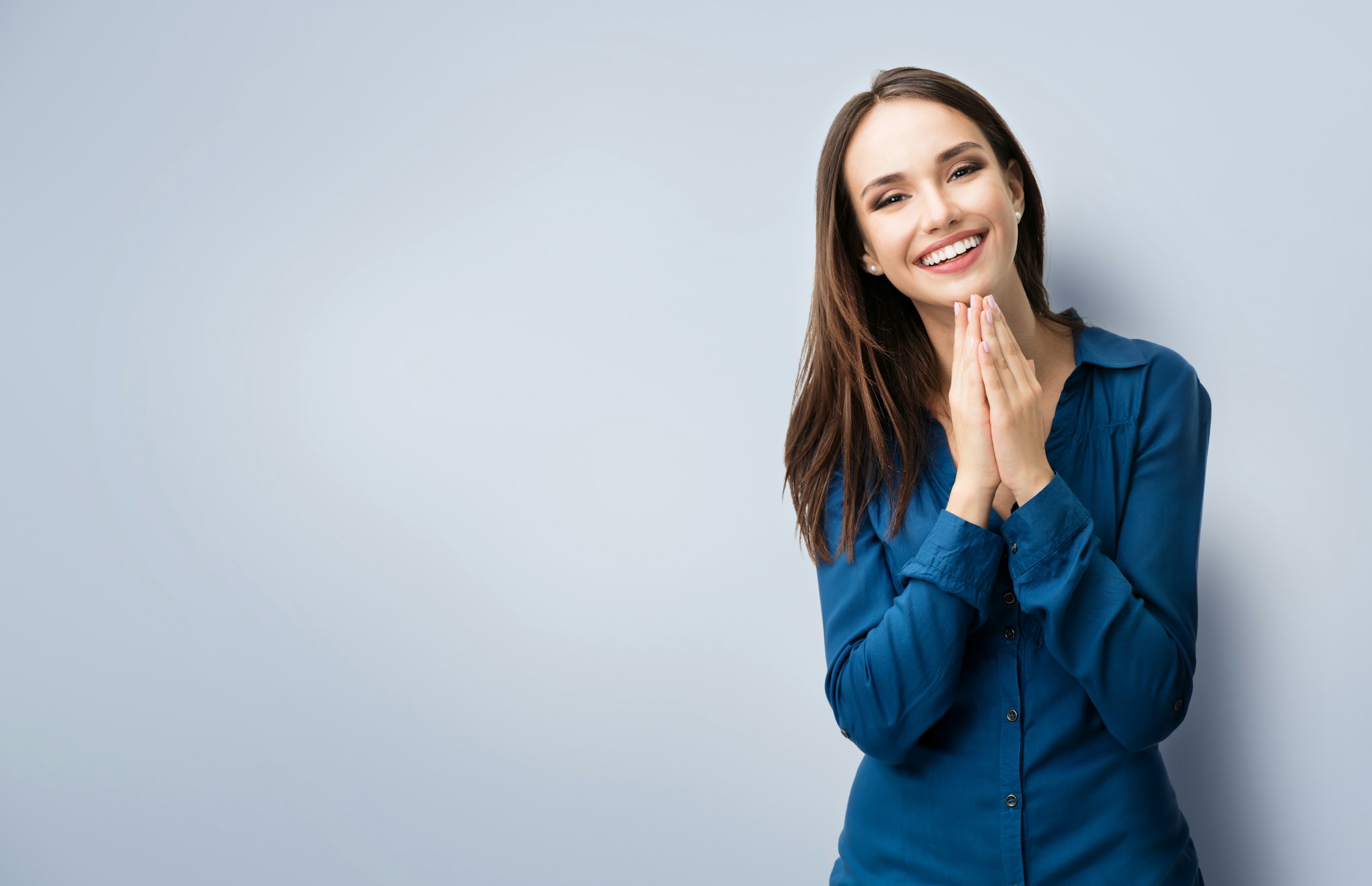 happy gesturing smiling young woman, with copyspace