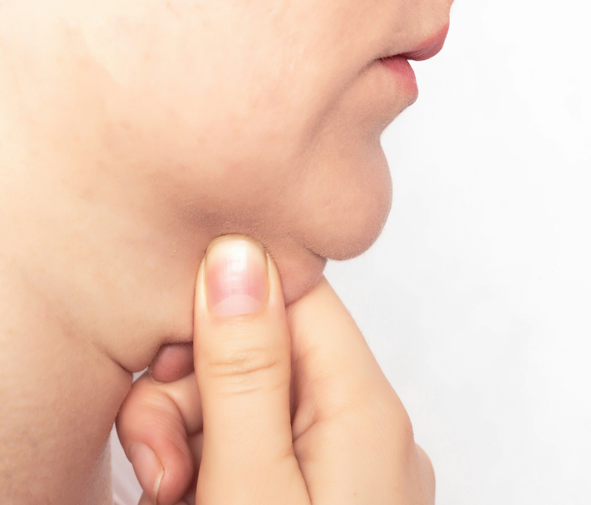 woman grabbing her double chin fat