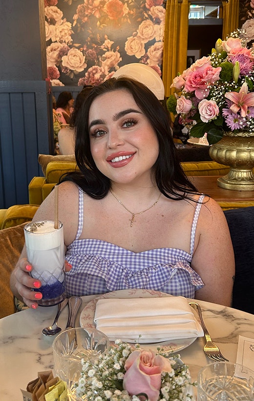 Hannah drinking a purple drink