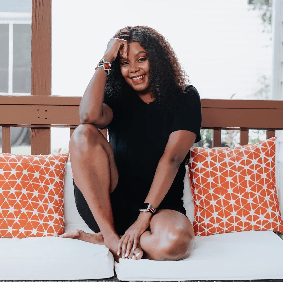 Idah sitting on outdoor couch