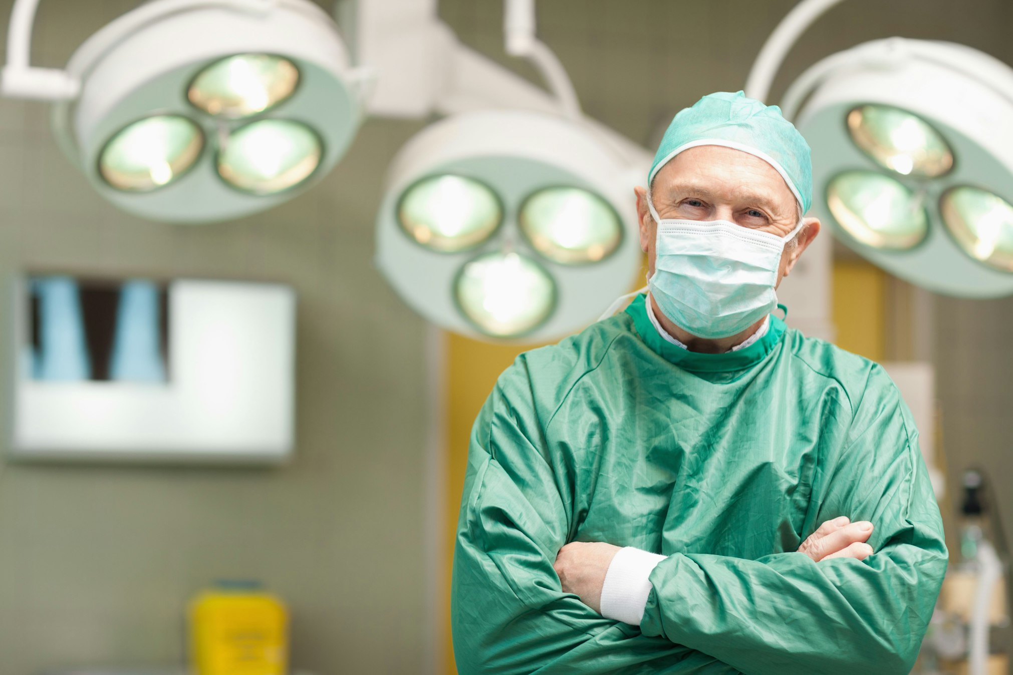Surgeon smiling with arms crossed