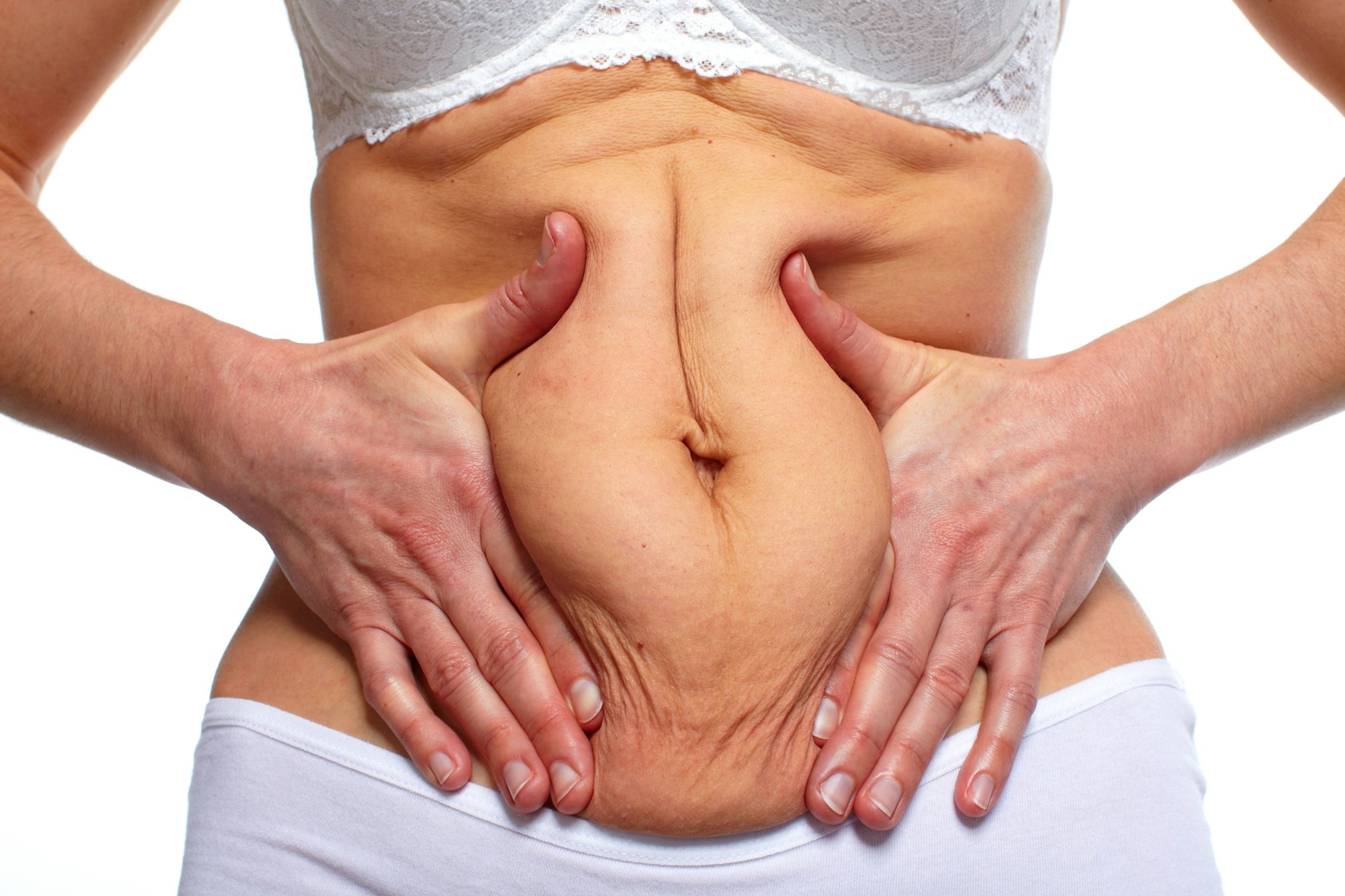 person squishing tummy together