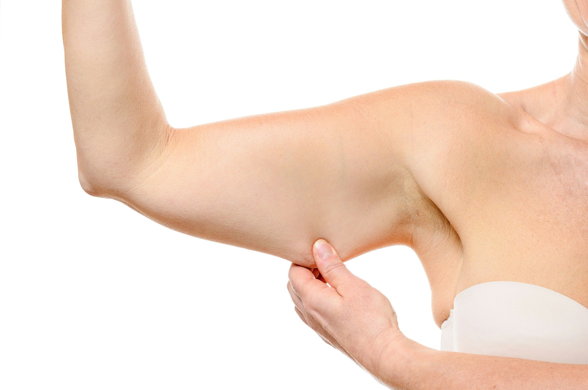 woman pinching underarm fat
