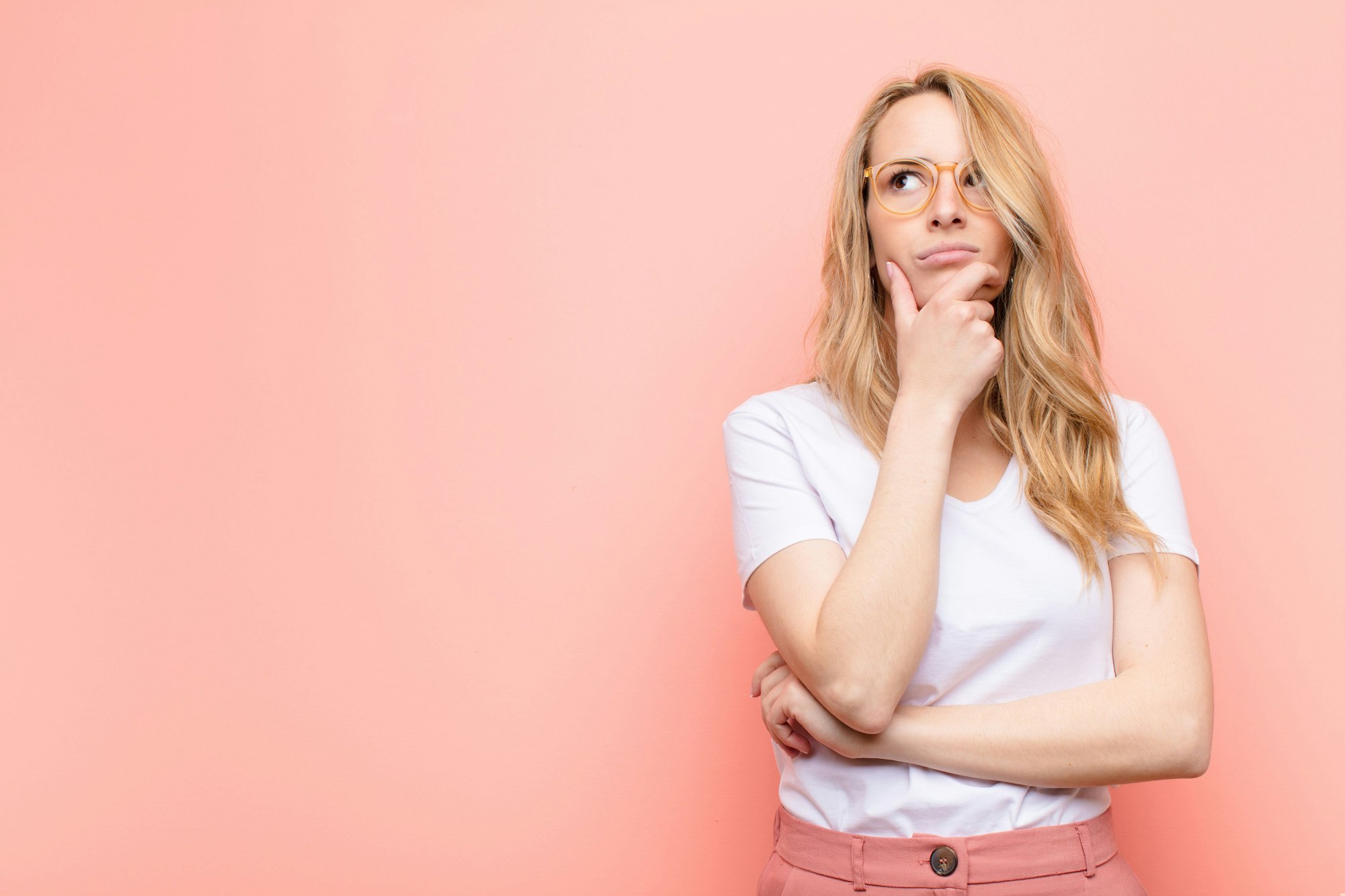 blonde woman pondering