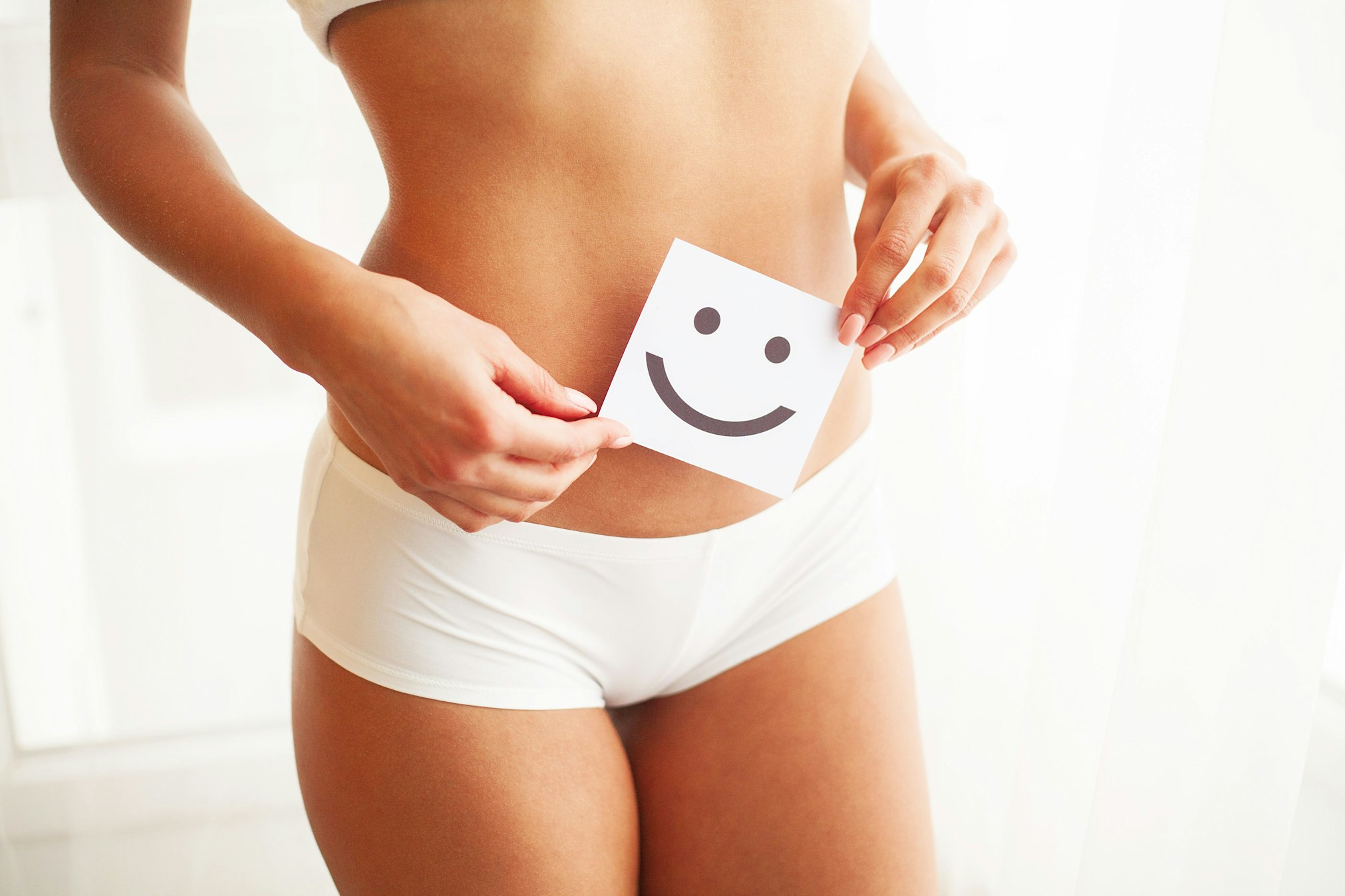 holding happy face over belly