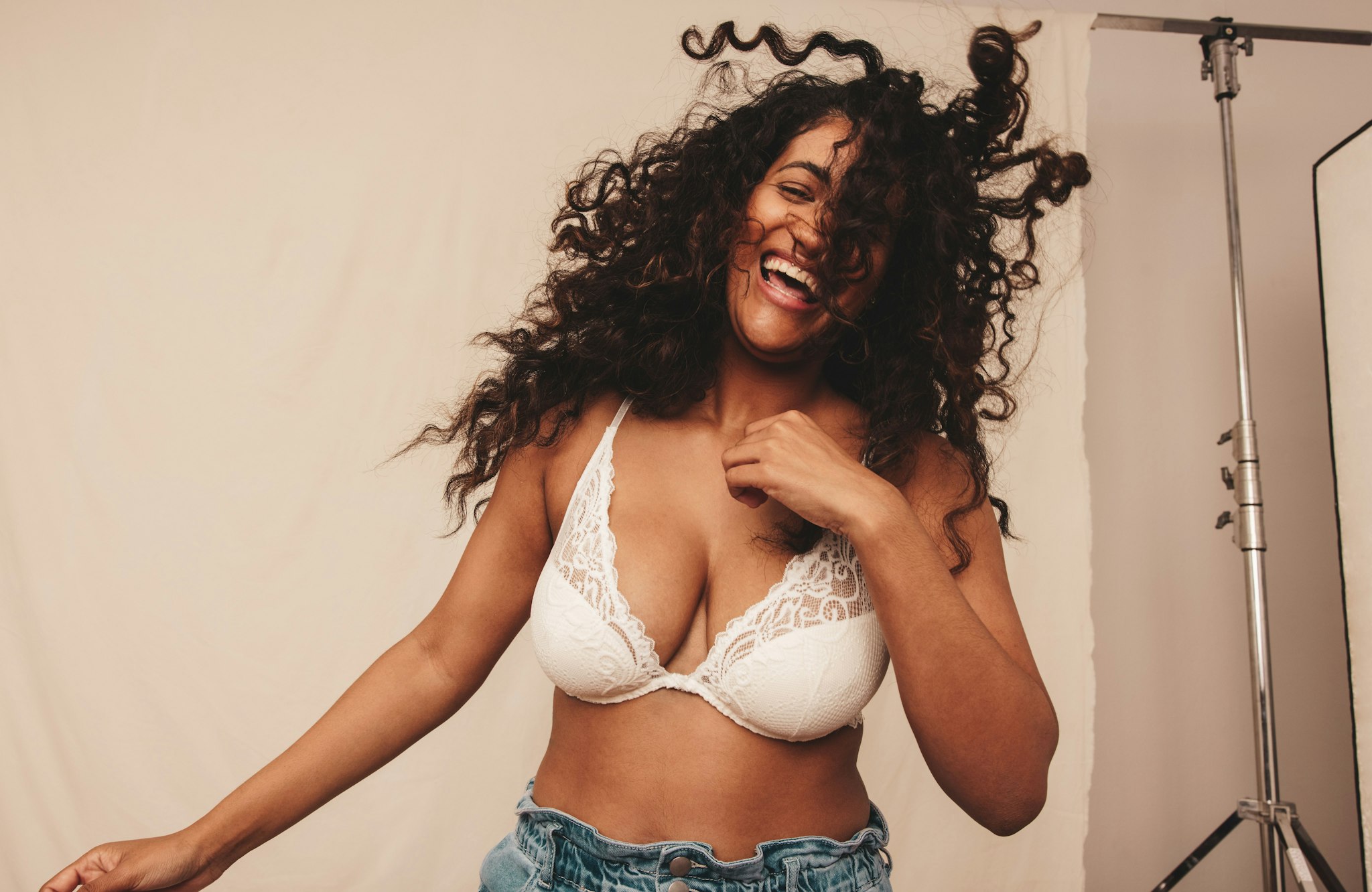 woman laughing in bra