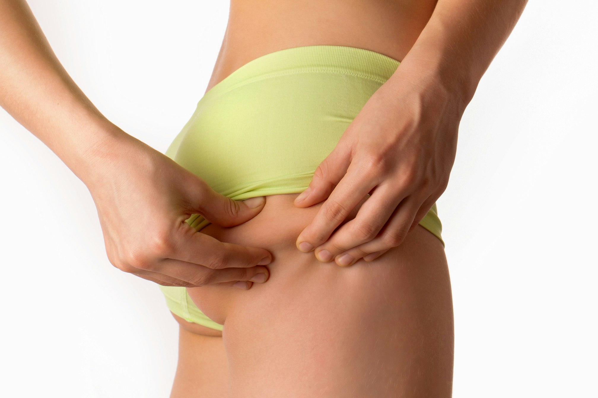 woman pinching her buttocks