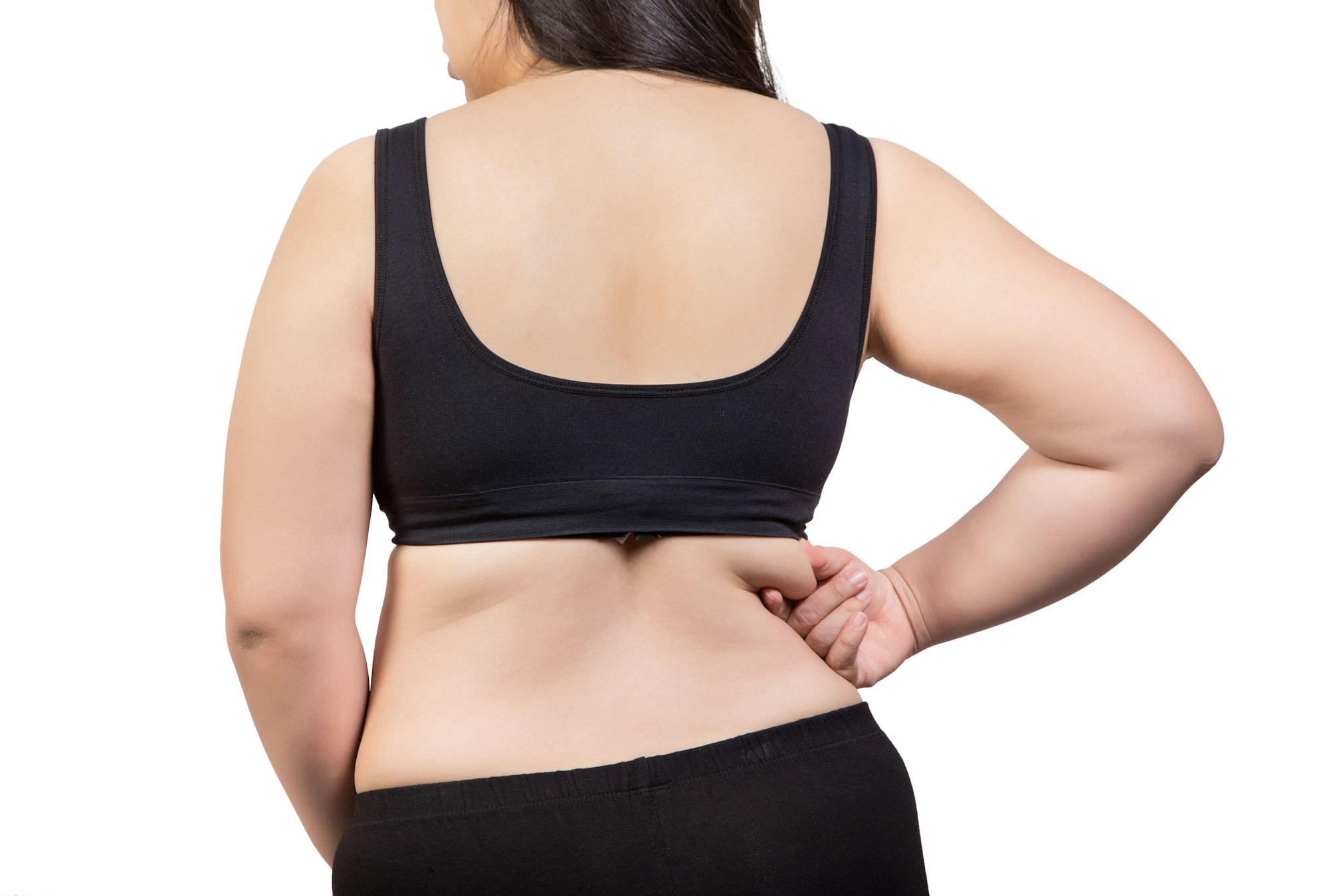 woman pinching back fat