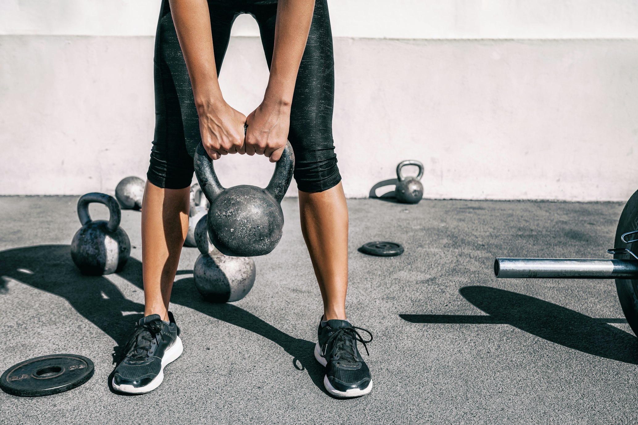 person with kettle bell