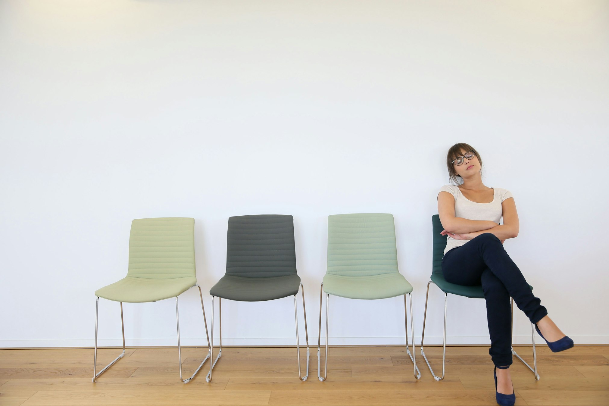 woman with legs crossed waiting