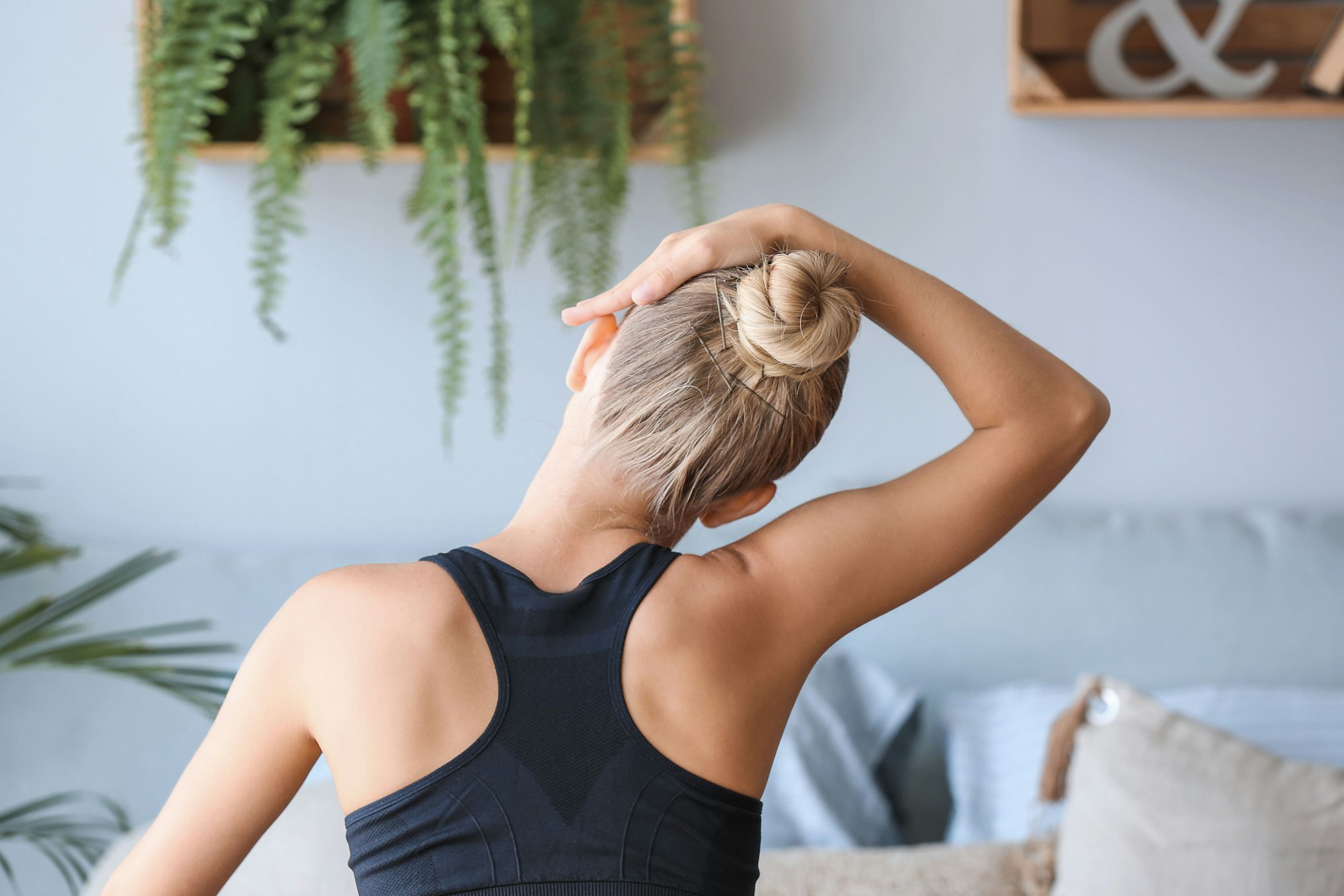 woman stretching neck to the side