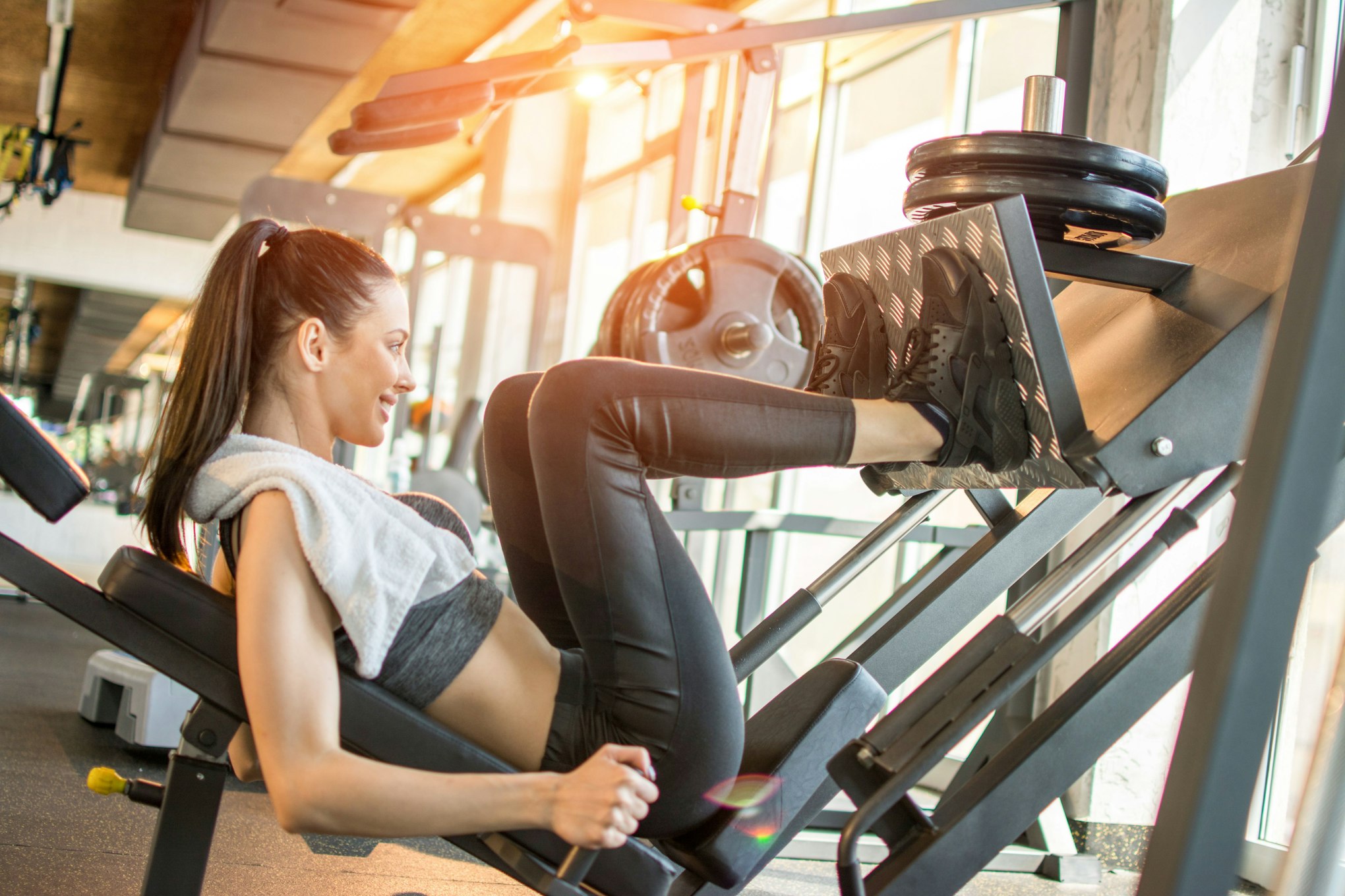 woman on leg workout machine