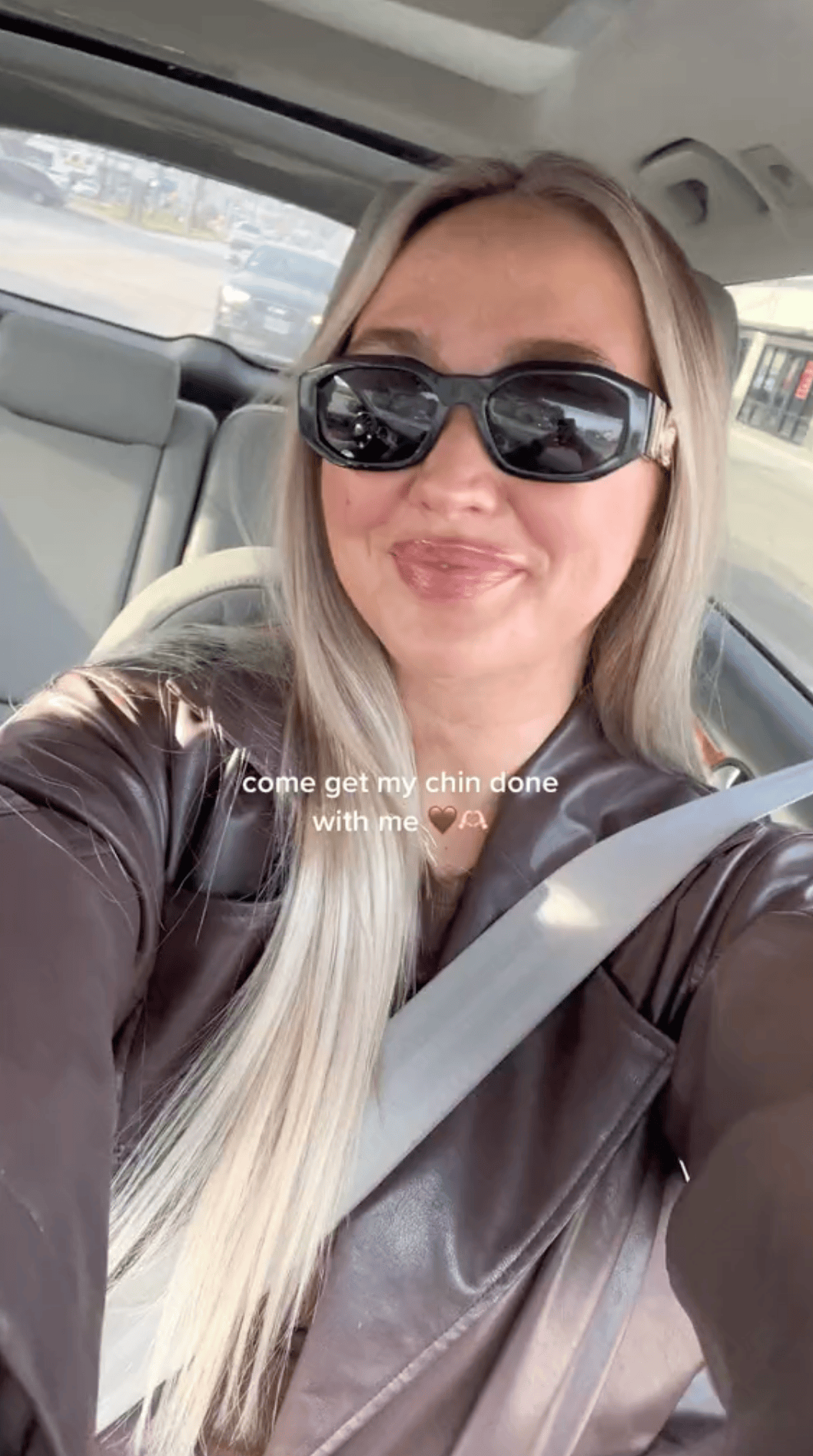 Photo of Kenzie Elizabeth in her car before getting Chin AirSculpt