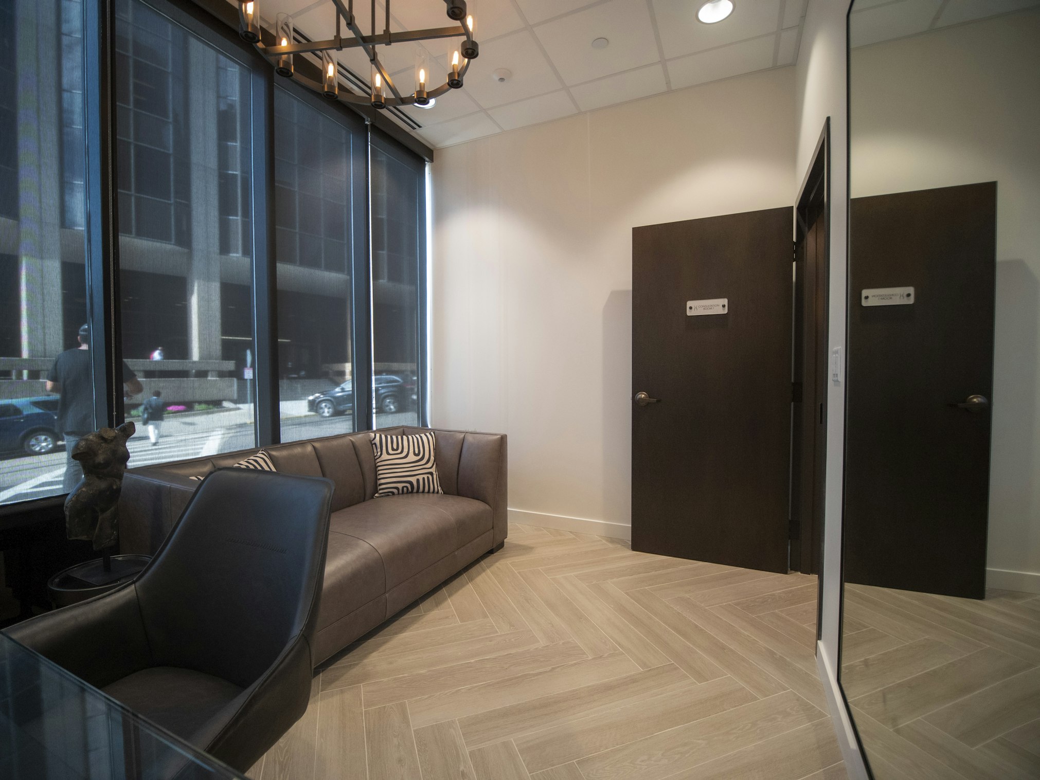 Couch within AirSculpt Body Contouring Boston clinic consultation room