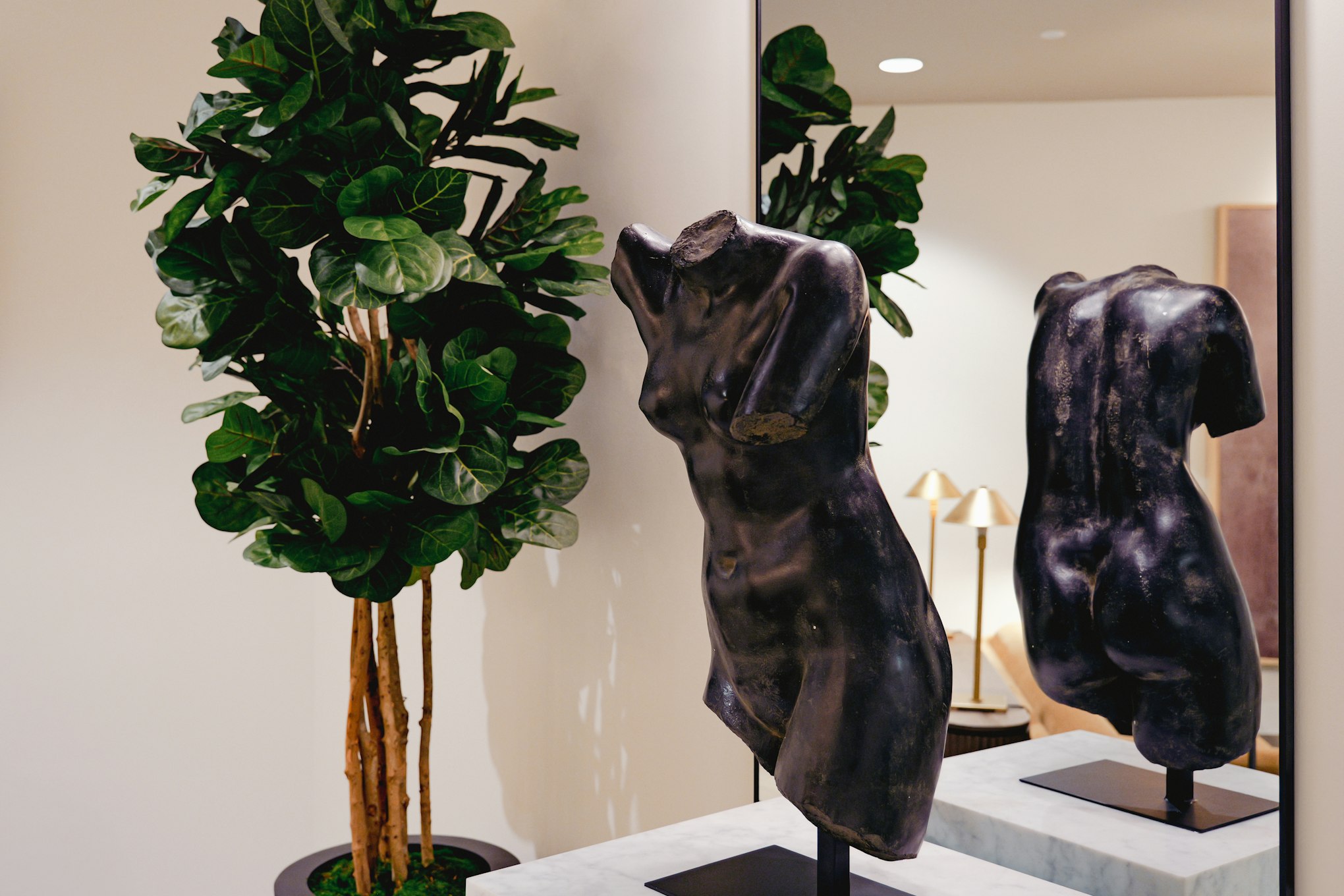 Sculpture of a chiseled torso in the lobby in AirSculpt Body Contouring Columbus clinic