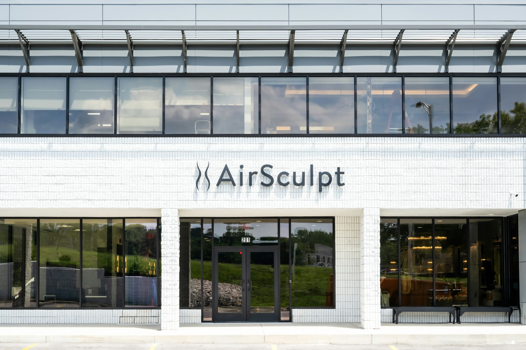 Exterior façade with AirSculpt Body Contouring Kansas City clinic signage