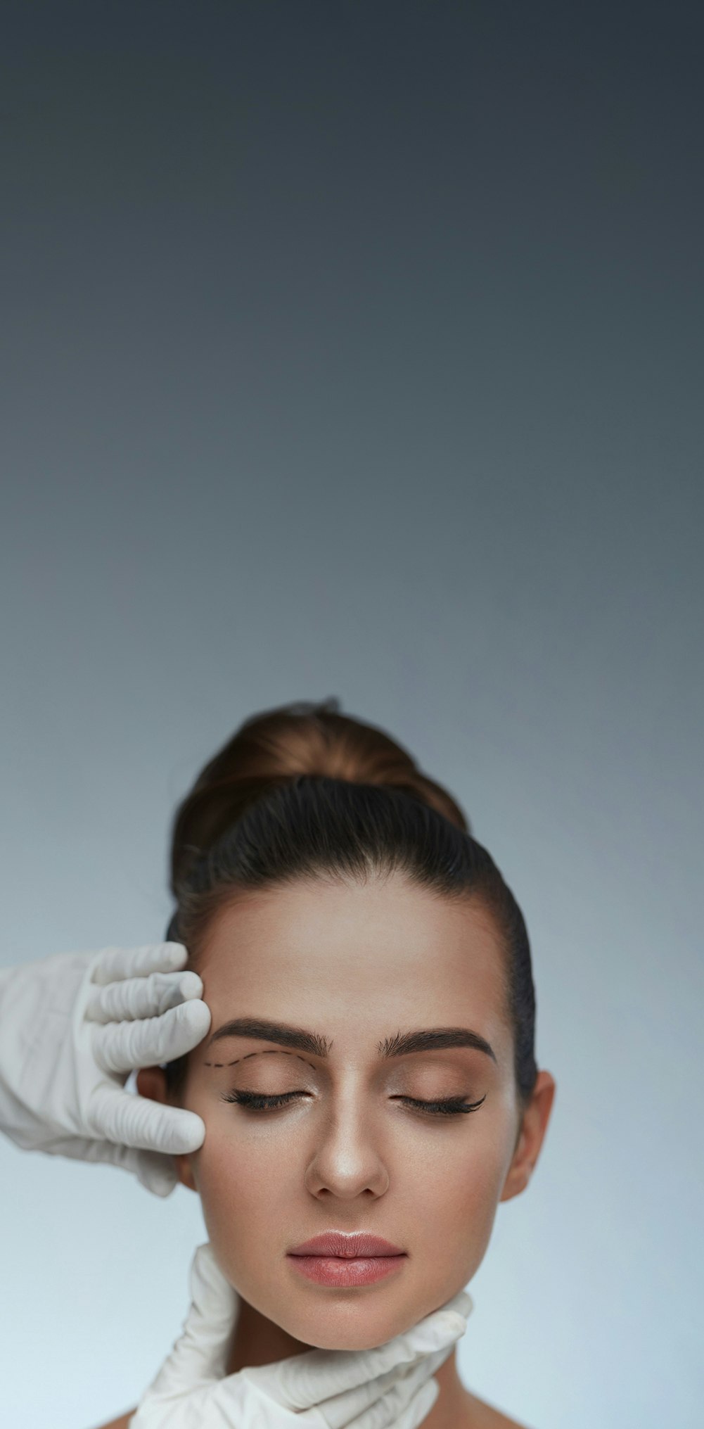 womans face being touched by gloved hands