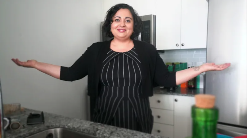 Options purchaser Visha Gandhi stands in her kitchen