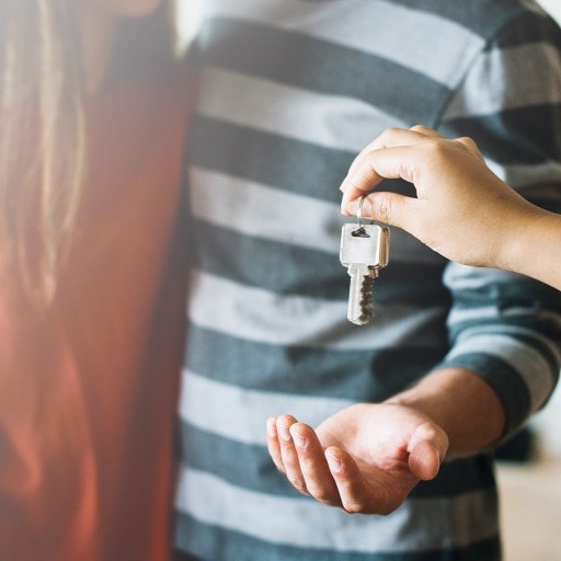 A homeowner receives keys to home