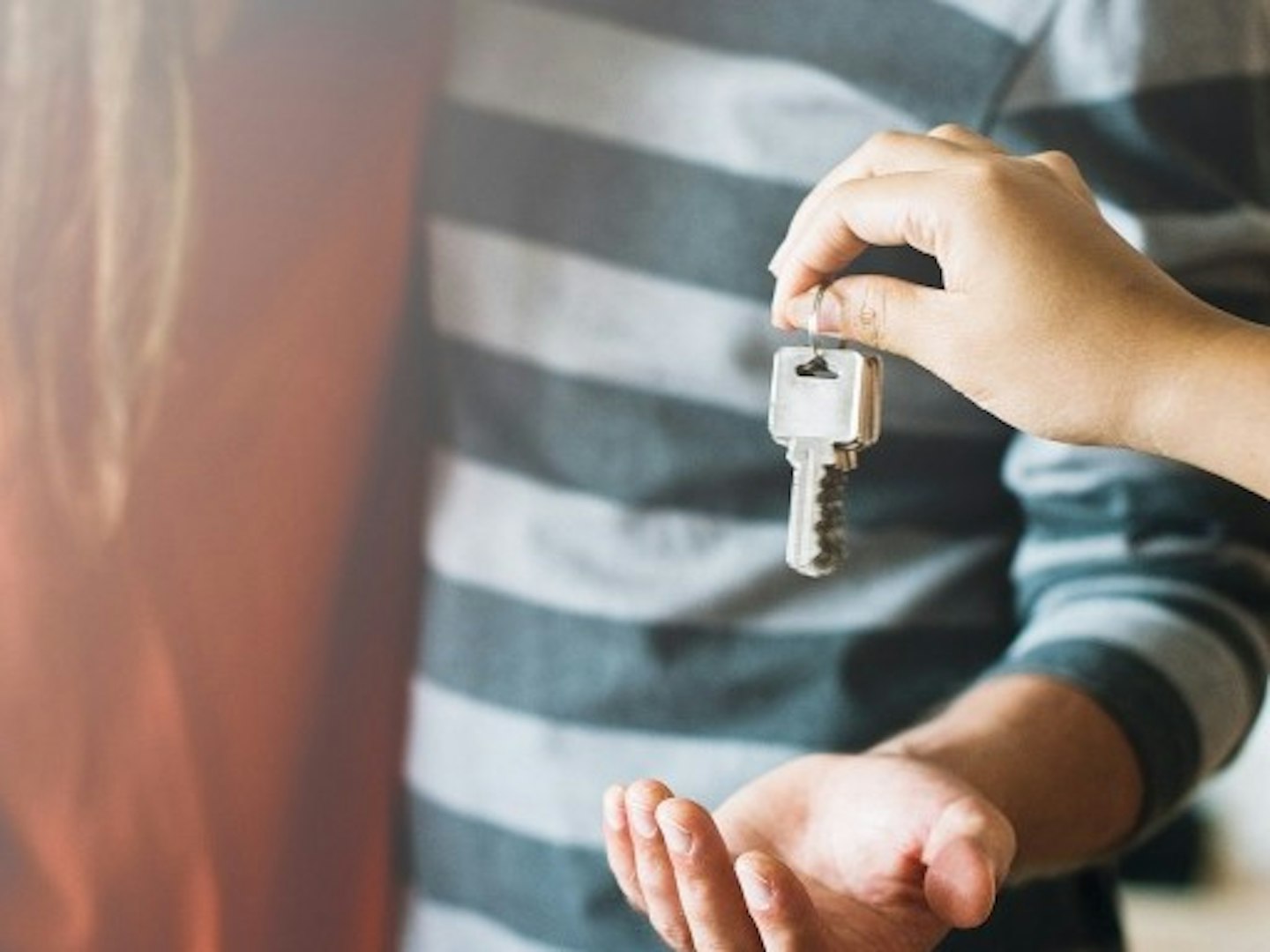 A homeowner receives keys to home