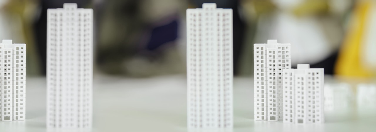 Models of high-rise buildings on table