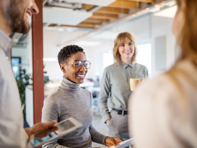 Multi-ethnic business team having a standing meeting in office