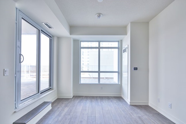 Living room with window and sliding balcony door