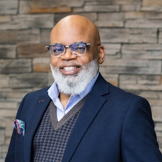 a headshot portrait of Gregory Banfield