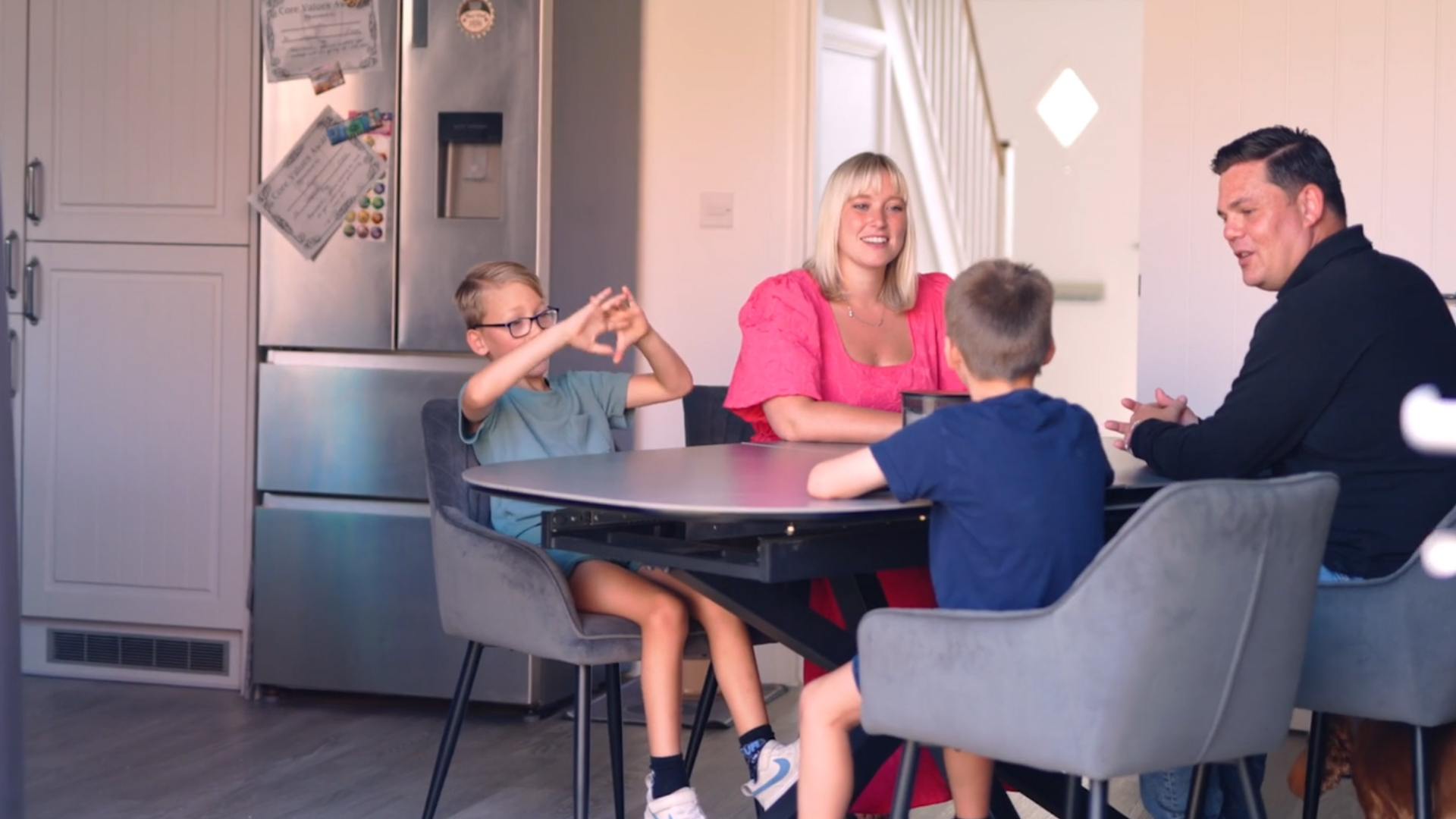 Karl, Emily and family in the kitchen of their new Home Reach  Shared Ownership home