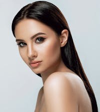 Model posing for the camera and looking to the side.