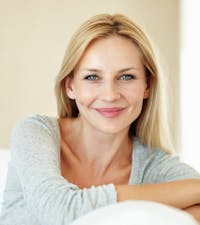 Blonde woman posing on a couch
