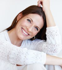 Woman posing and smiling.