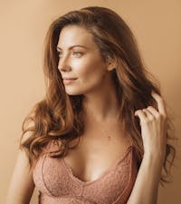 A woman in a pink bra