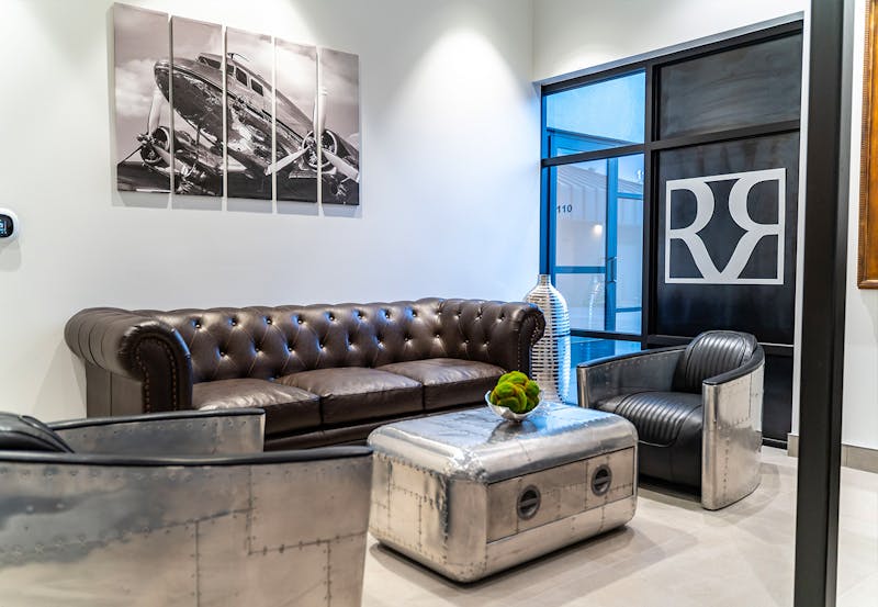 Waiting area with couch and chairs